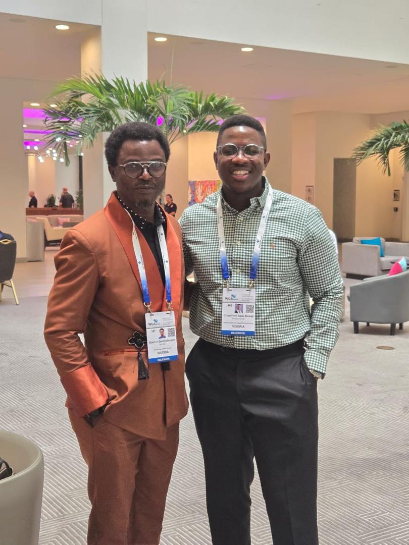 Oluwafemi with a fellow delegate at the WCA conference